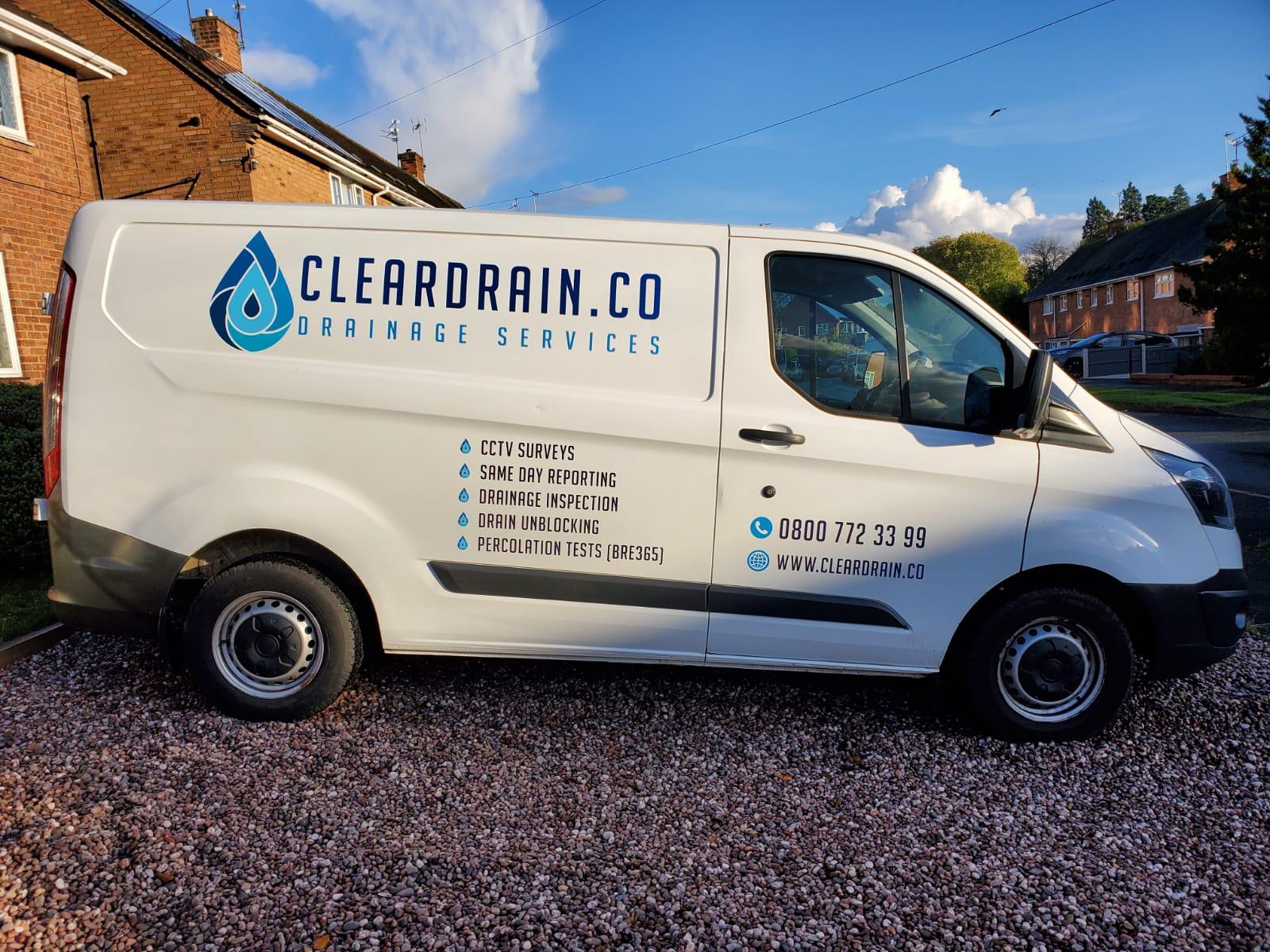 A Clear Drain van in full livery, parked on a Black Country street