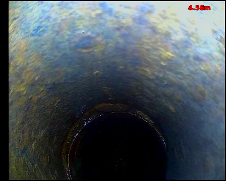 Close CCTV view of a pipe joint, with the socket of the next pipe length visible